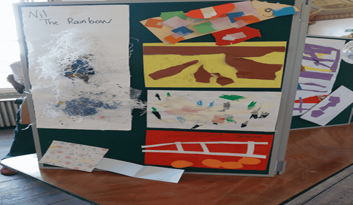 display board showing a range of children's art made of colourful paper